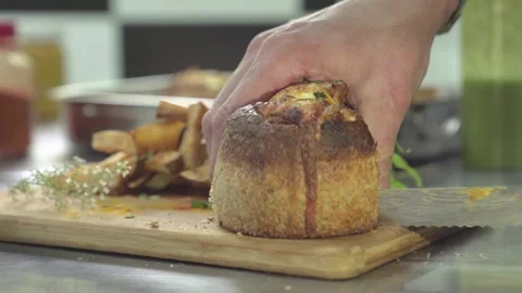 A man cutting a pancook in half in a restaurant Stock Footage 240472789