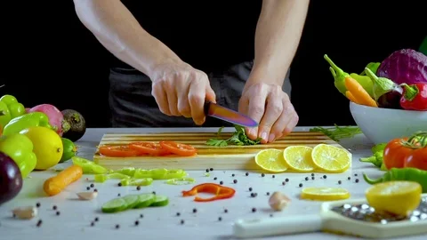 Man is cutting parsley in the kitchen Stock Footage 98202569