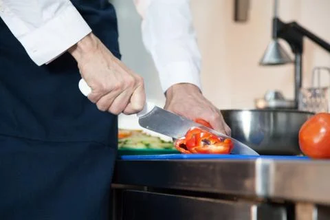 Man cutting a pepper Stock Photos