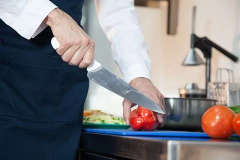 Man cutting a pepper Stock Photos
