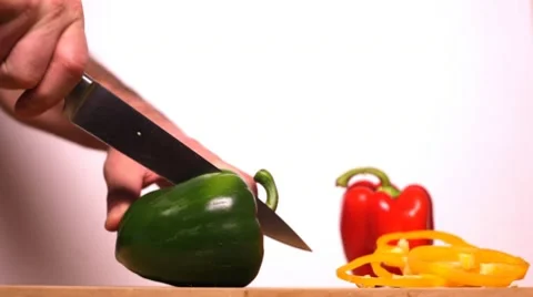 Man Cutting Peppers Stock Footage