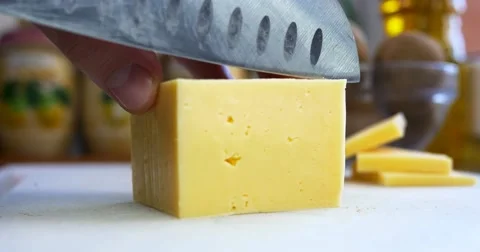 Man cutting piece of cheese Video stock 61963627