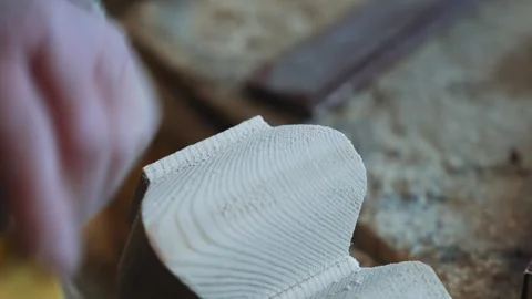 A man is cutting a piece of fruit with a knife Stock Footage 301792820