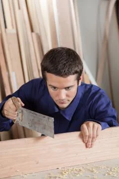 Man cutting a plank Stock Photos