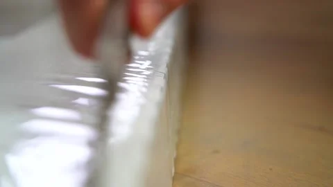 Man cutting plastic cover with the knife Stock Footage 159528064