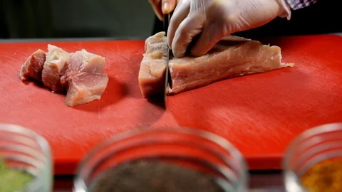 Man cutting pork Stock Footage 102585595