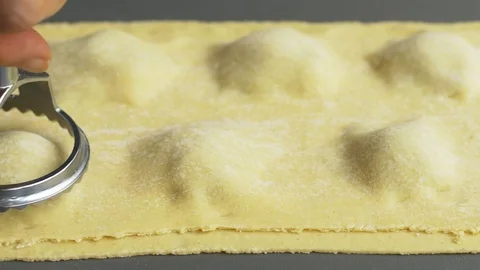 Man is cutting ravioli Stock Footage 71239559