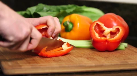 Man cutting red bell pepper close up Stock Footage 61393639