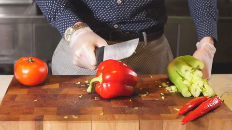Man cutting a red pepper Stock Footage 102583816