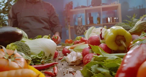 Man cutting a red pepper into half Stock Footage 311833371