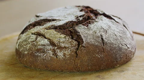 Man cutting rye bread with long knife, closeup view Stock Footage 58737337