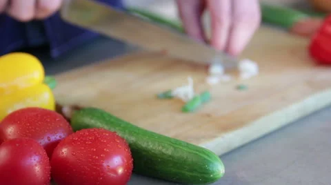 Man cutting scallion Stock Footage 40986519