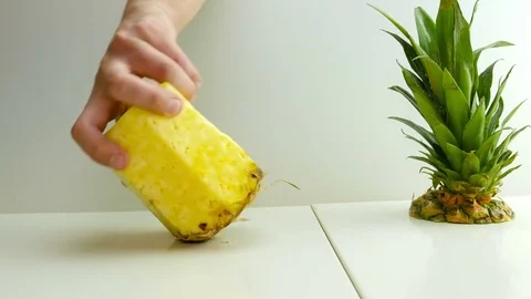 Man cutting slicing pineapple Stock Footage 75497613