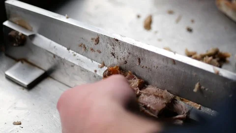 Man cutting small baked ribs Stock Footage 88828048
