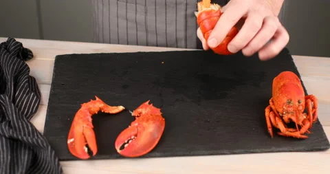 Man cutting the tail of lobster Stock Footage 104702210