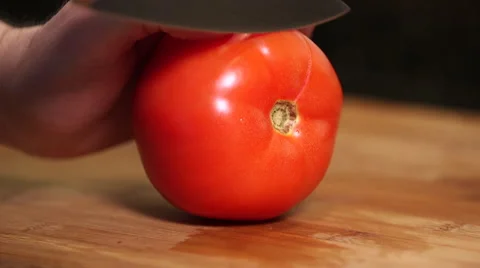 Man cutting tomato close up Stock Footage 61394451