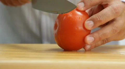 Man cutting tomato Stock Footage 27305700