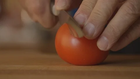 Man cutting tomato Stock Footage 94565107