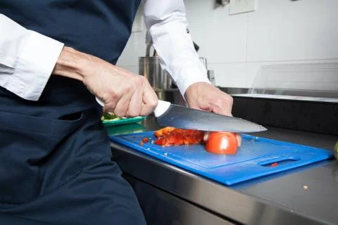 Man cutting a tomato Stock Photos