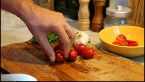 Man cutting tomatoes Stock Footage 84945038