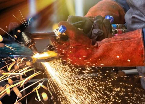 Man with cutting torch Stock Photos