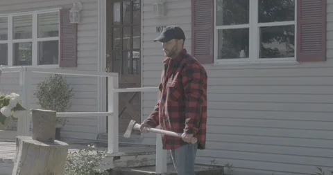 Man Cutting Tree Trunk With Axe Stock Footage 101659797