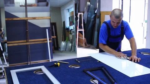 Man cutting triplex glass Stock Footage 70072712