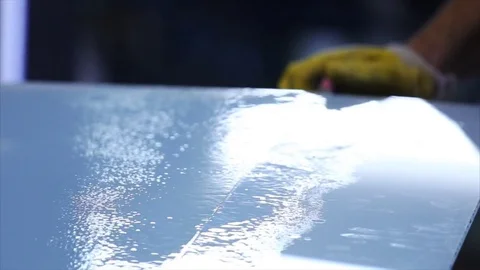 Man cutting a triplex glass in the workshop Stock Footage 69916360