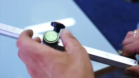 Man cutting a triplex glass in the workshop Stock Footage 69916419