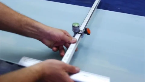 Man cutting a triplex glass in the workshop Stock Footage 69916587