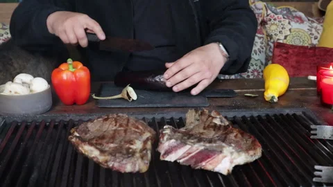 Man cutting vegetables for grilling on black board close-up Stock Footage 280406892