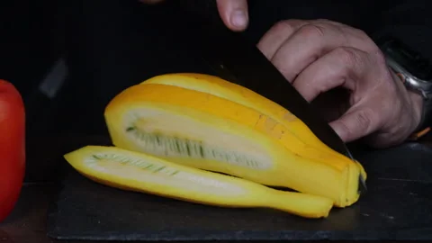Man cutting vegetables for grilling on black board close-up Stock Footage 280407798