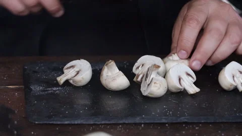 Man cutting vegetables for grilling on black board close-up 動画素材 280409044