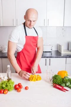 Man cutting vegetables Stock Photos