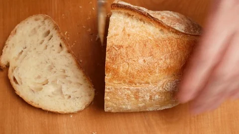 Man cutting white bread. Stock Footage 71567455