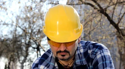 Man cutting wood with electric saw Stock Footage