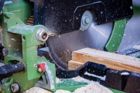 Man cutting wood using a circular saw Stock Photos