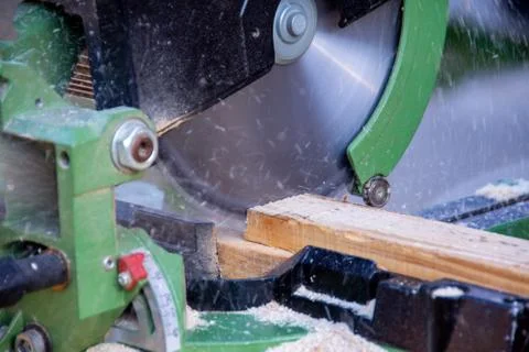Man cutting wood using the circular saw Stock Photos