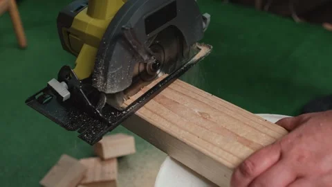 Man cutting wooden plank with circular saw close up Stock Footage 345313509