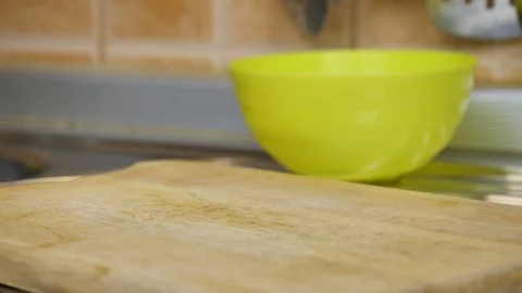 Man cutting yellow bell pepper with white knife Stock Footage 87301190
