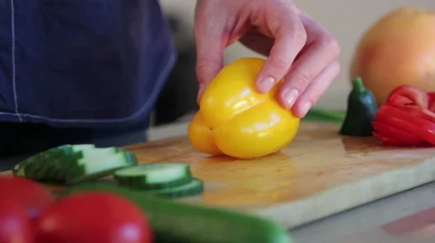 Man cutting a yellow pepper Stock Footage 41010958