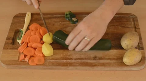Man cutting zucchini Stock Footage 22097727
