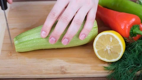 Man cutting zucchini Stock Footage 232876114