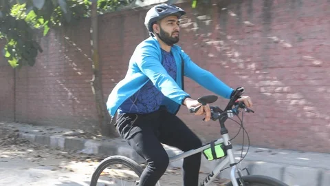 Man cycle riding on road Stock Footage 113730835