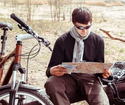 Man cyclist with map Stock Photos