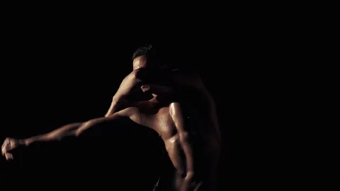 Man dance in a flashing light Stock Footage 85883897