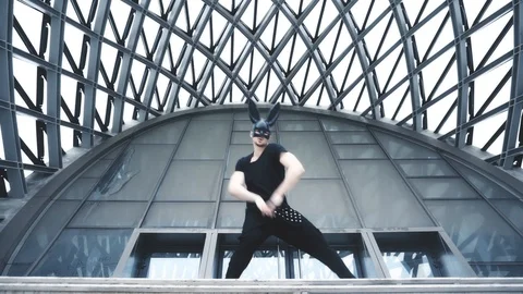 Man dance in mask in city Stock Footage 98984619
