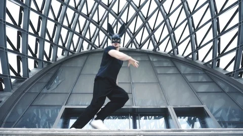 Man dance in mask in city Video stock 98985428