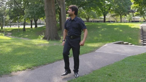 A man dances about at the park outside - shot on RED Stock Footage 124718480