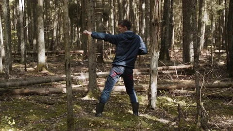 Man dances cheerful with his back in for... | Stock Video | Pond5
